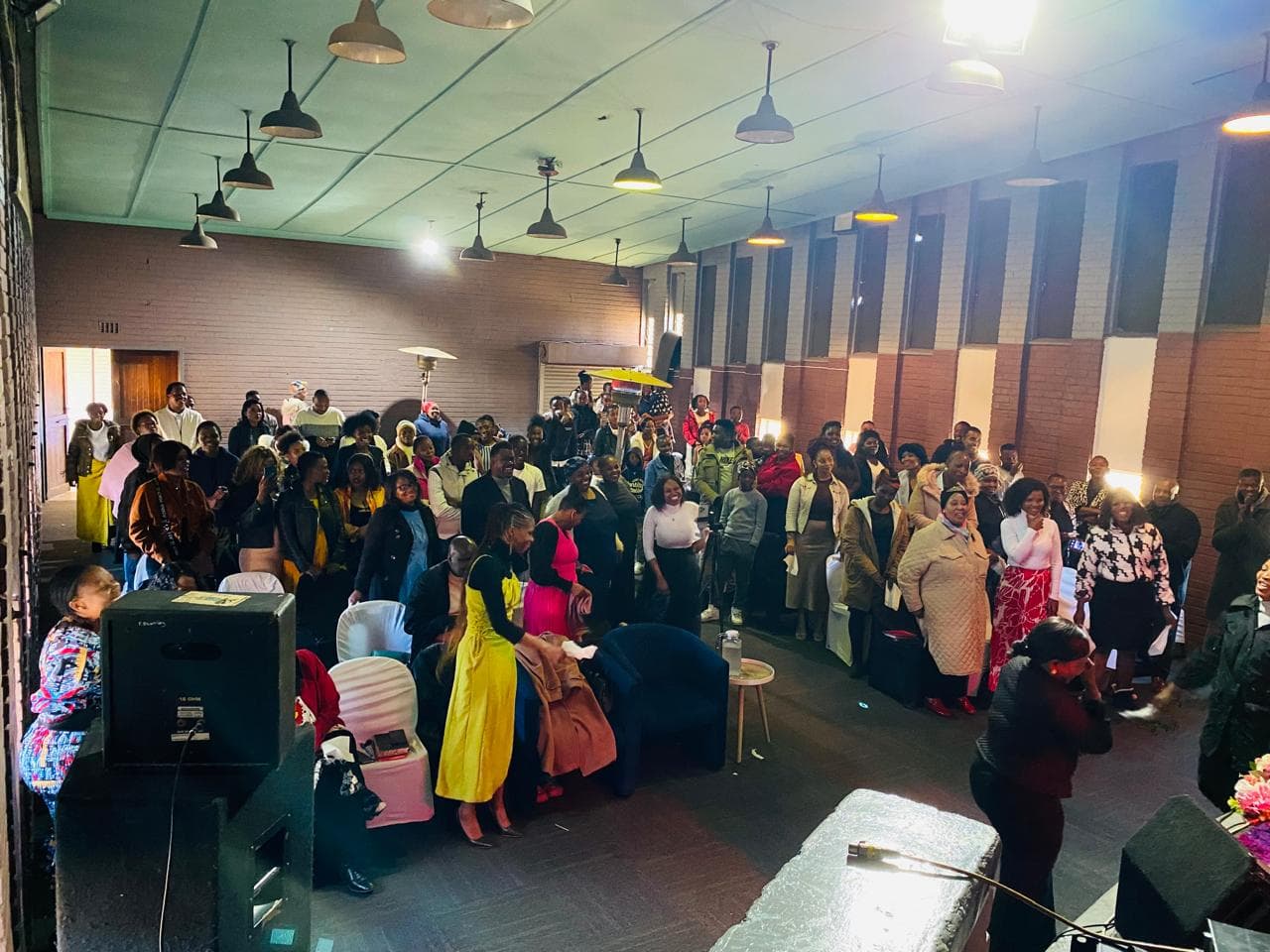 Front-facing congregation worship moment at Renewed Life.